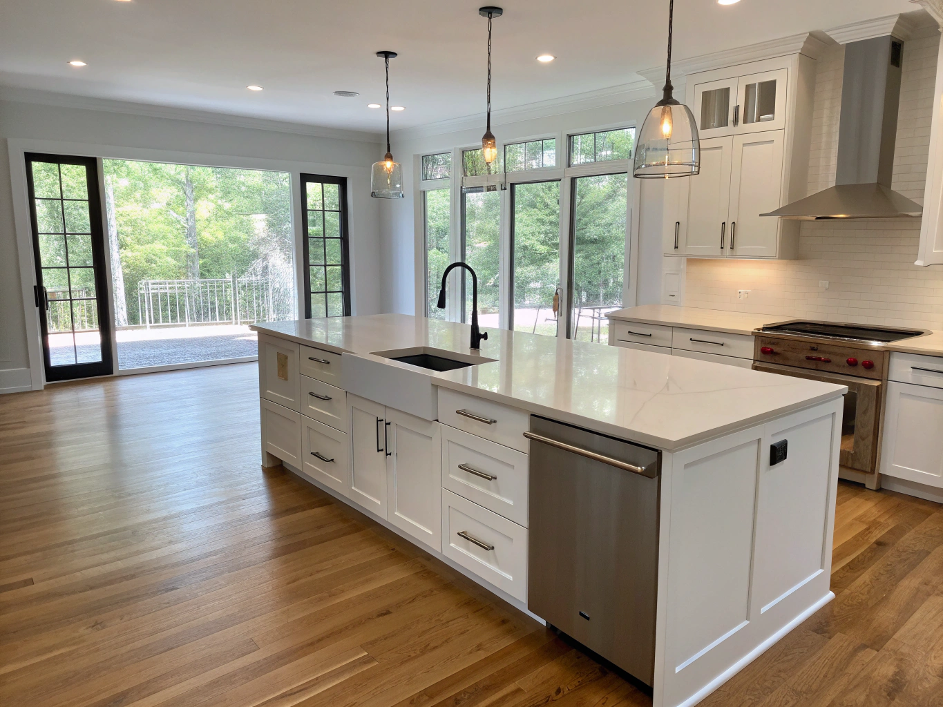 Luxury signature custom kitchen renovation with European cabinetry and a premium quartz waterfall island